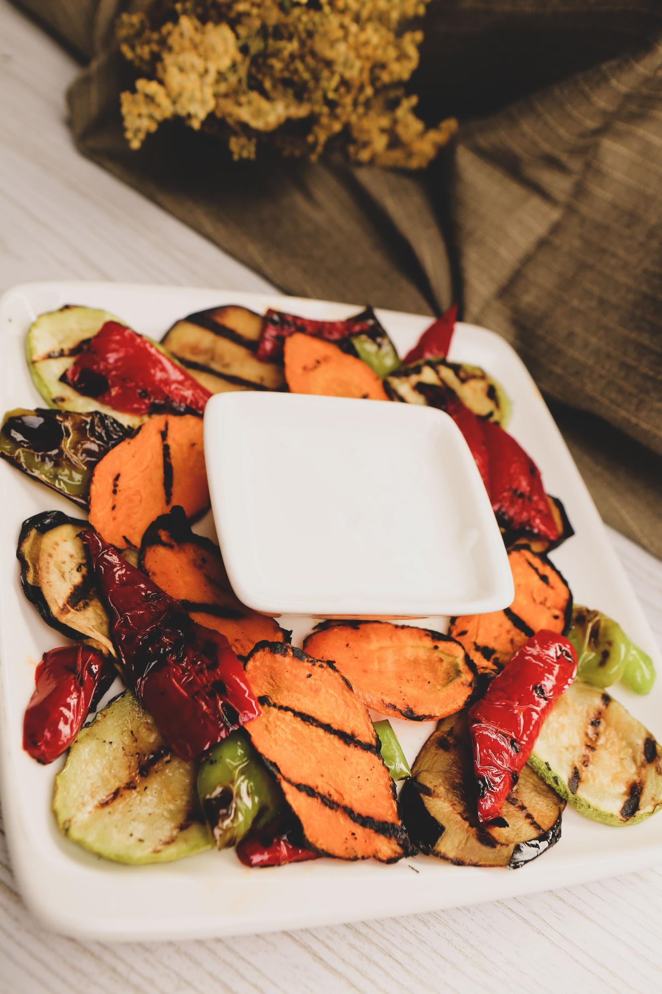 Close-up of roasted vegetables on a rustic tray